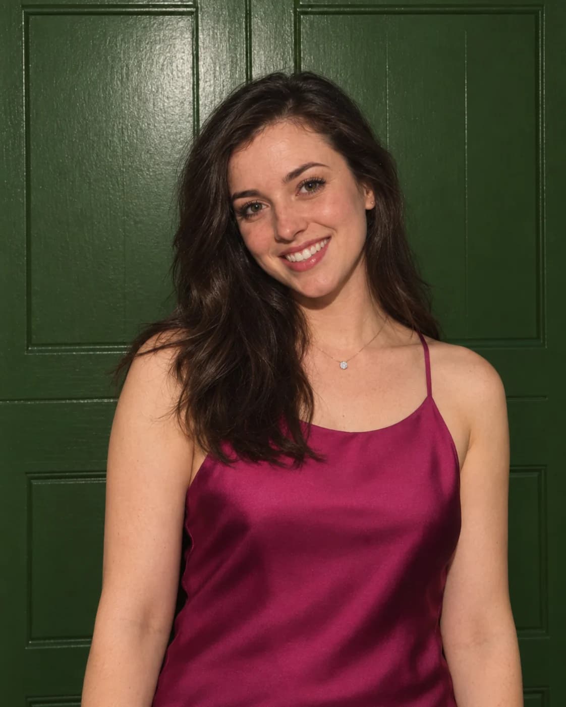 Clean portrait of a woman in a magenta satin dress recovered from a handheld print